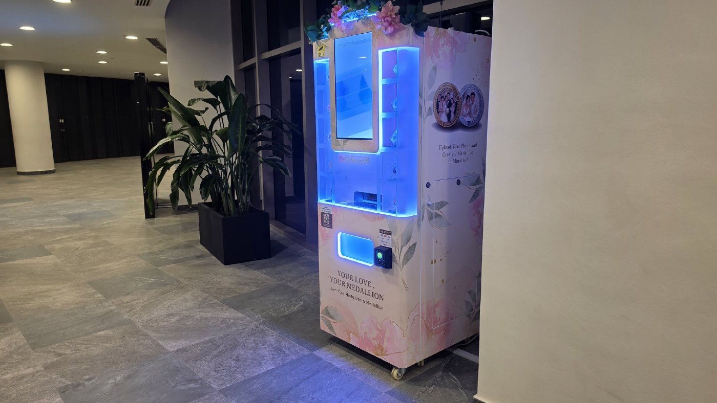 Side view of the DIY Medallion machine near the indoor plants